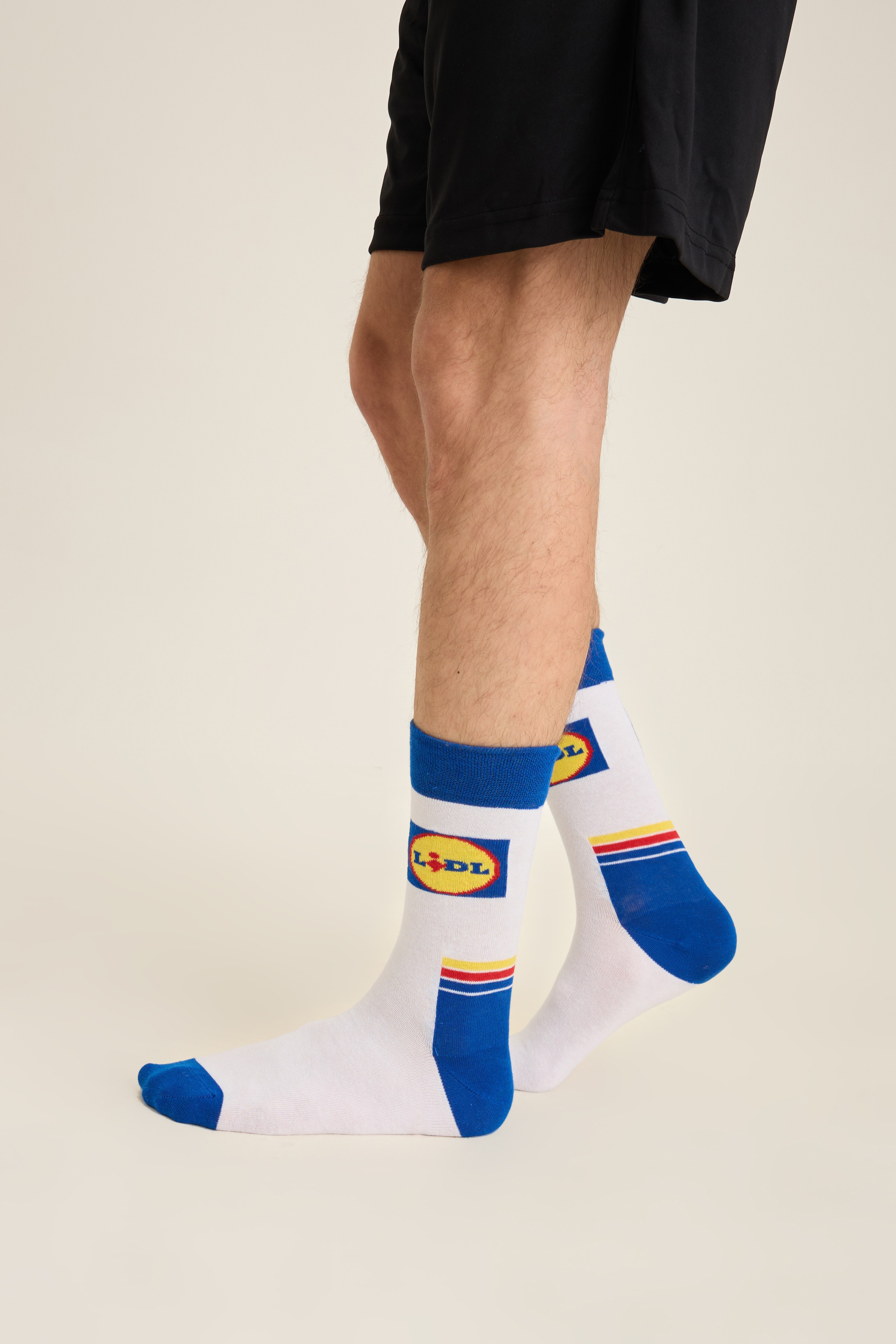 White branded crew socks produced for a retail private-label program
