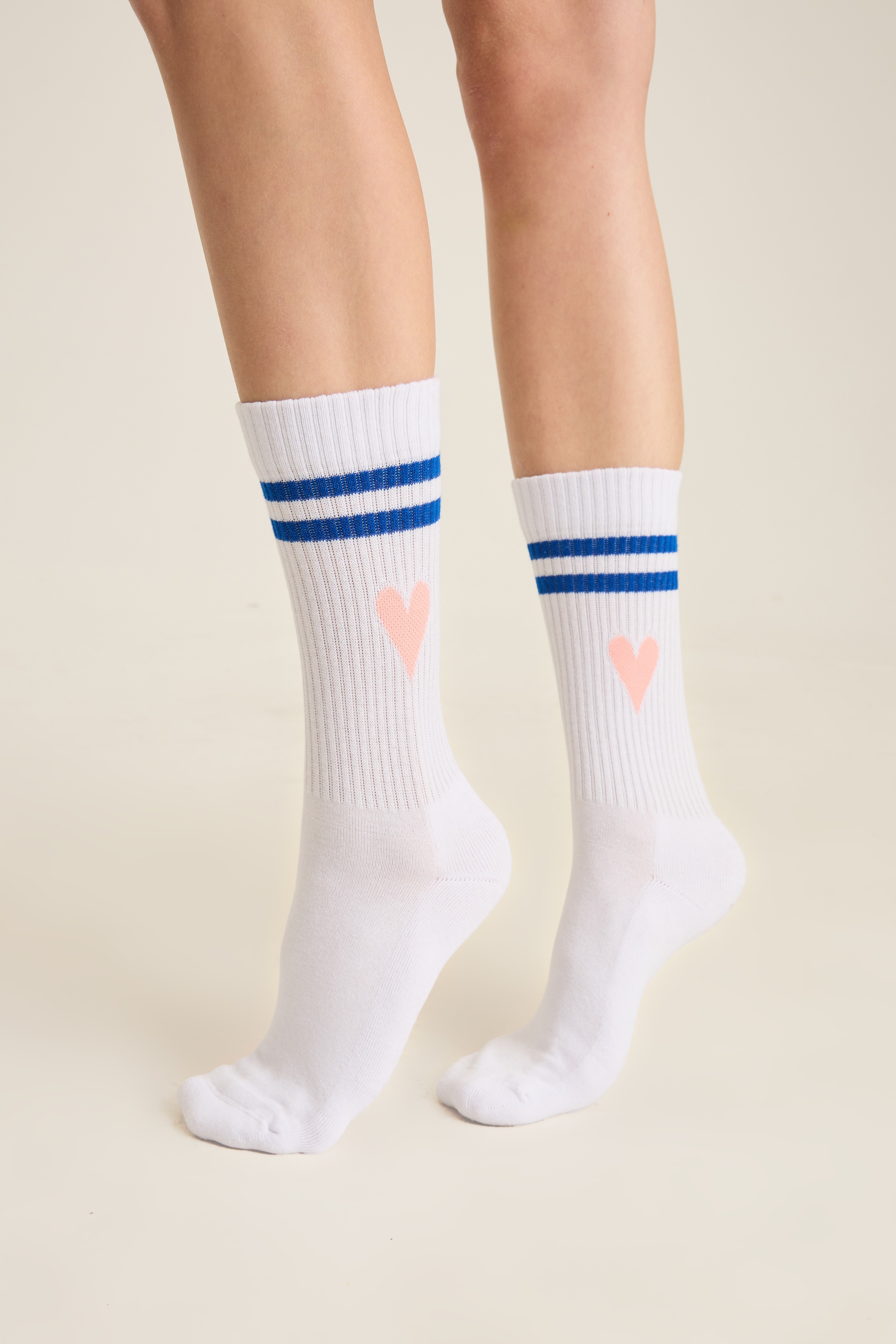 White ribbed socks with twin blue stripes and a small pink heart