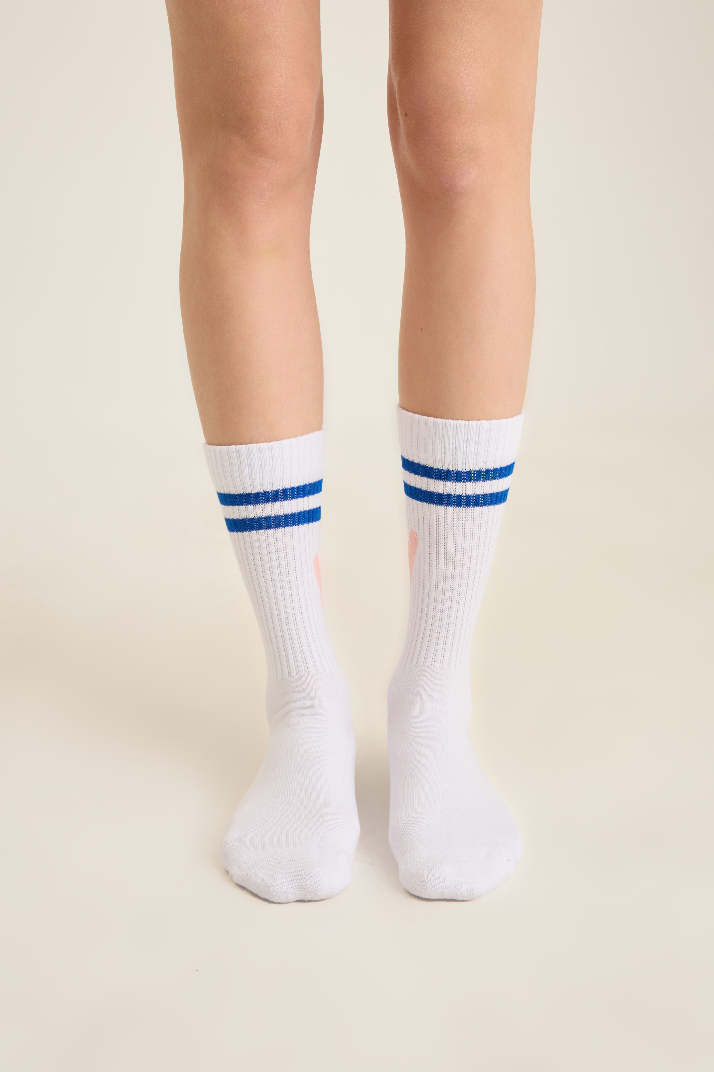 White ribbed sport socks with twin royal blue stripes